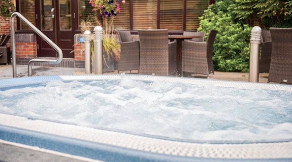 Cottons Hotel & Spa Outdoor Area with Hot Tub